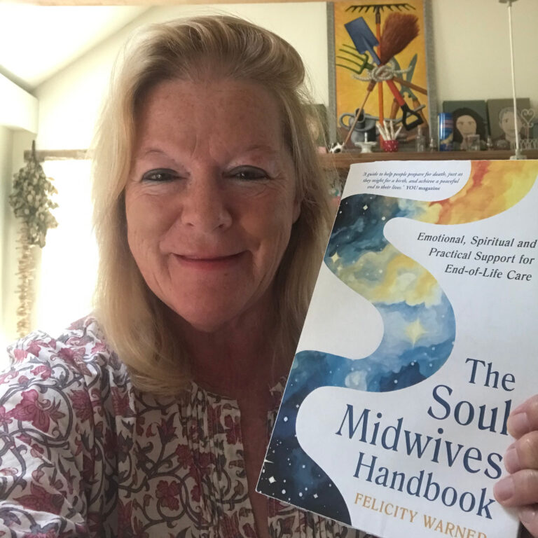 Felicity Warner with a copy of The Soul Midwives' Handbook (Revised Edition)